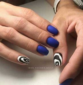 Blue manicure with imitation cow skin print