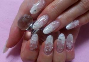 Wedding lace manicure with rhinestones and pearls decoration