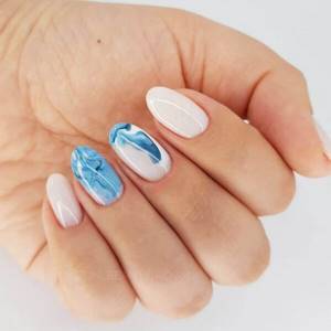 Light manicure with a blue pattern