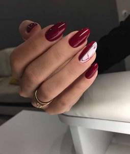 Dark red manicure with glitter