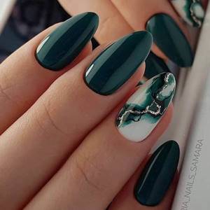 Dark green shades of manicure