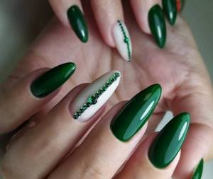 Dark green shades of manicure