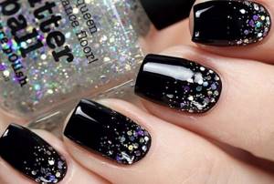 dark manicure with glitter