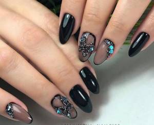 Dark manicure with rhinestones
