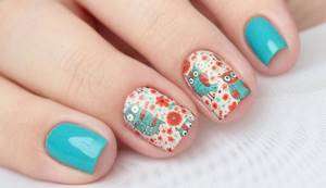 Bright owls and flowers in turquoise manicure