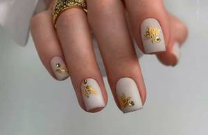 gold and rhinestones on nails