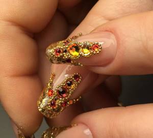 Gold manicure with beads
